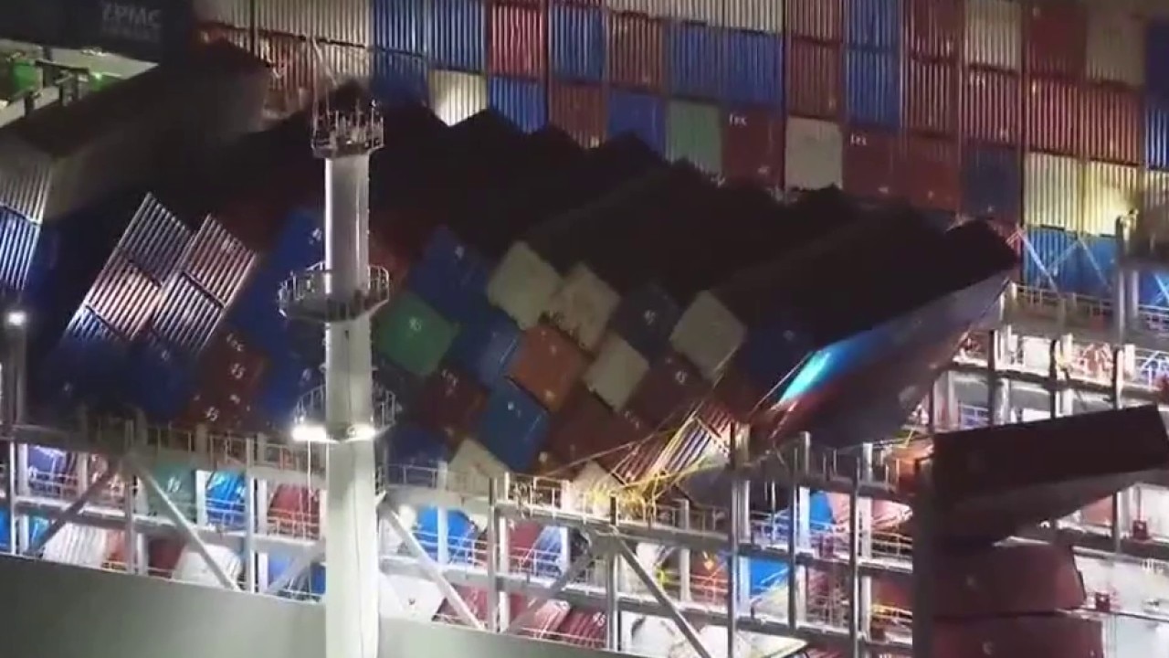Damaged cargo ship losing containers