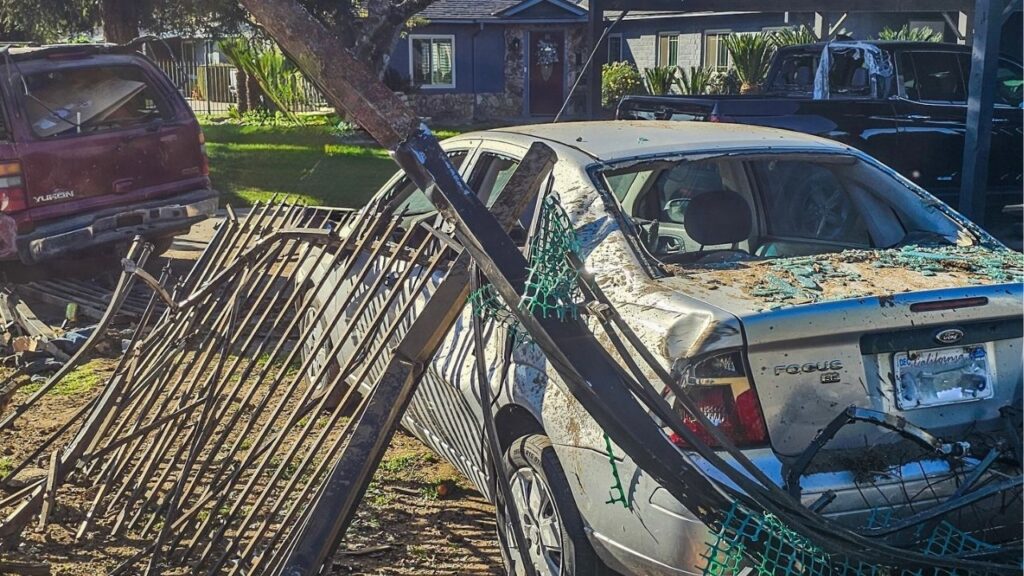 A driver crashed through fences and hit a parked car, the California Highway Patrol said on Thursday, March 5, 2026. (CHP)