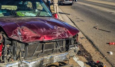 A driver traveling at high speeds on Clinton Avenue in Fresno lost control and crashed through two fences and a parked vehicle, with no serious injuries reported, according to the California Highway Patrol. (CHP)