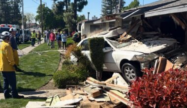 A vehicle veered off the road and crashed into a Fresno apartment building, causing minor injuries to the car's two occupants and displacing a family of three due to severe structural and gas line damage on Monday, March 9, 2026. (Fresno FD)