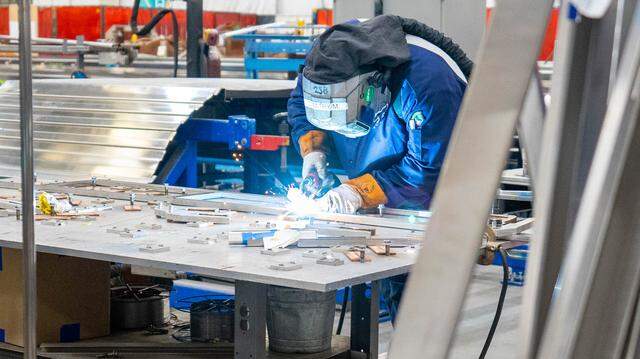 A Siemens worker assembles part of an Amtrak Airo train at the company’s manufacturing facility in Sacramento on Oct. 11, 2023. California could lose more manufacturing jobs without incentives to keep them here.
