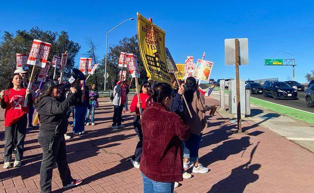 Striking teachers from Madison Elementary School, part of the Twin Rivers Unified School District, picket at the Madison Avenue Interstate 80 overpass on Thursday.