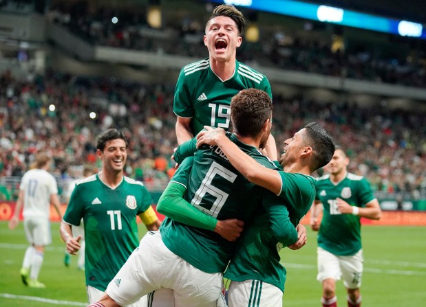 Mexico players celebrate a goal by Hugo Ayala during the second half of an international friendly soccer match against Bosnia and Herzegovina, Wednesday, Jan. 31, 2018, in San Antonio. Mexico won 1-0. (AP Photo/Darren Abate)