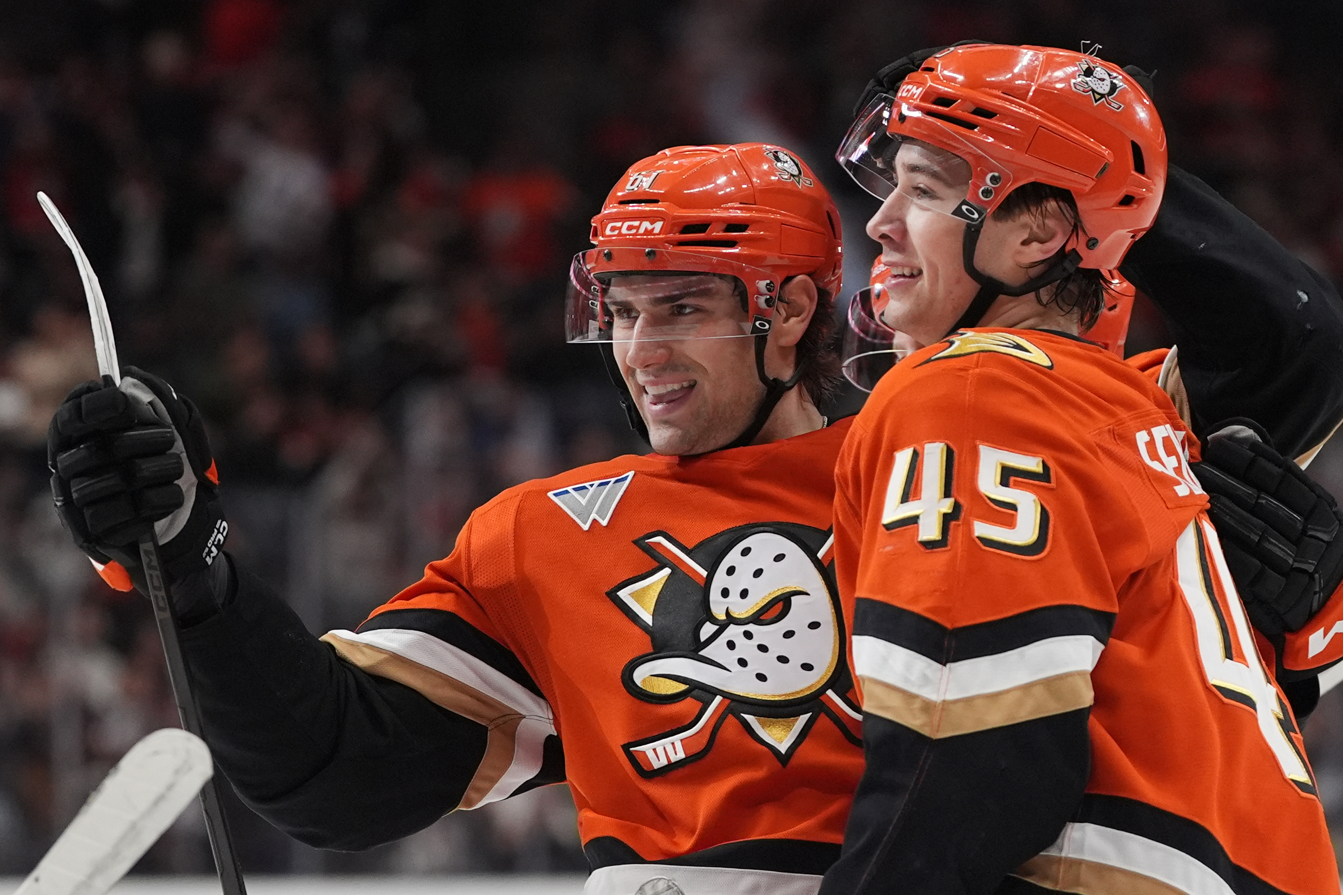 Ducks left wing Cutter Gauthier, left, celebrates his goal with...
