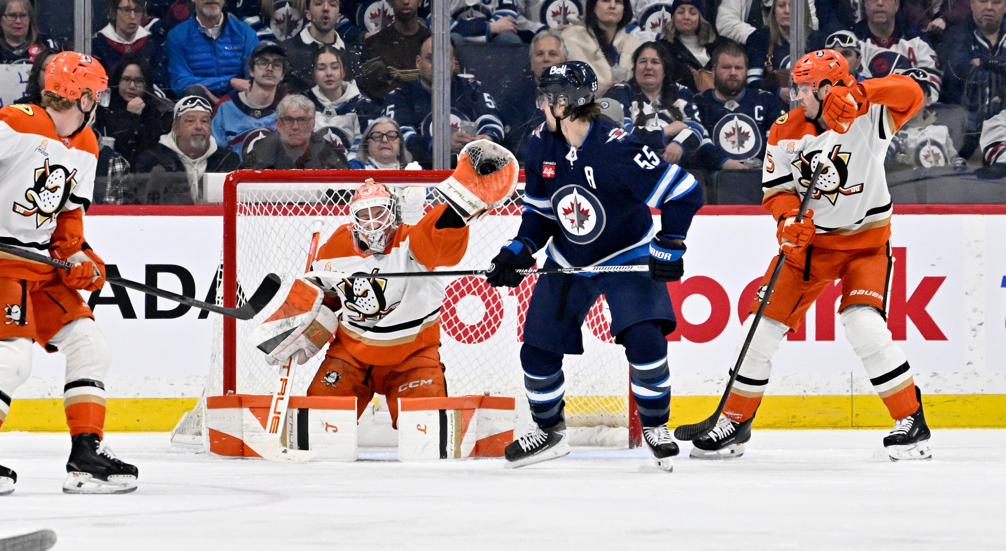 Ducks goaltender Lukas Dostal (1) makes a glove save on...