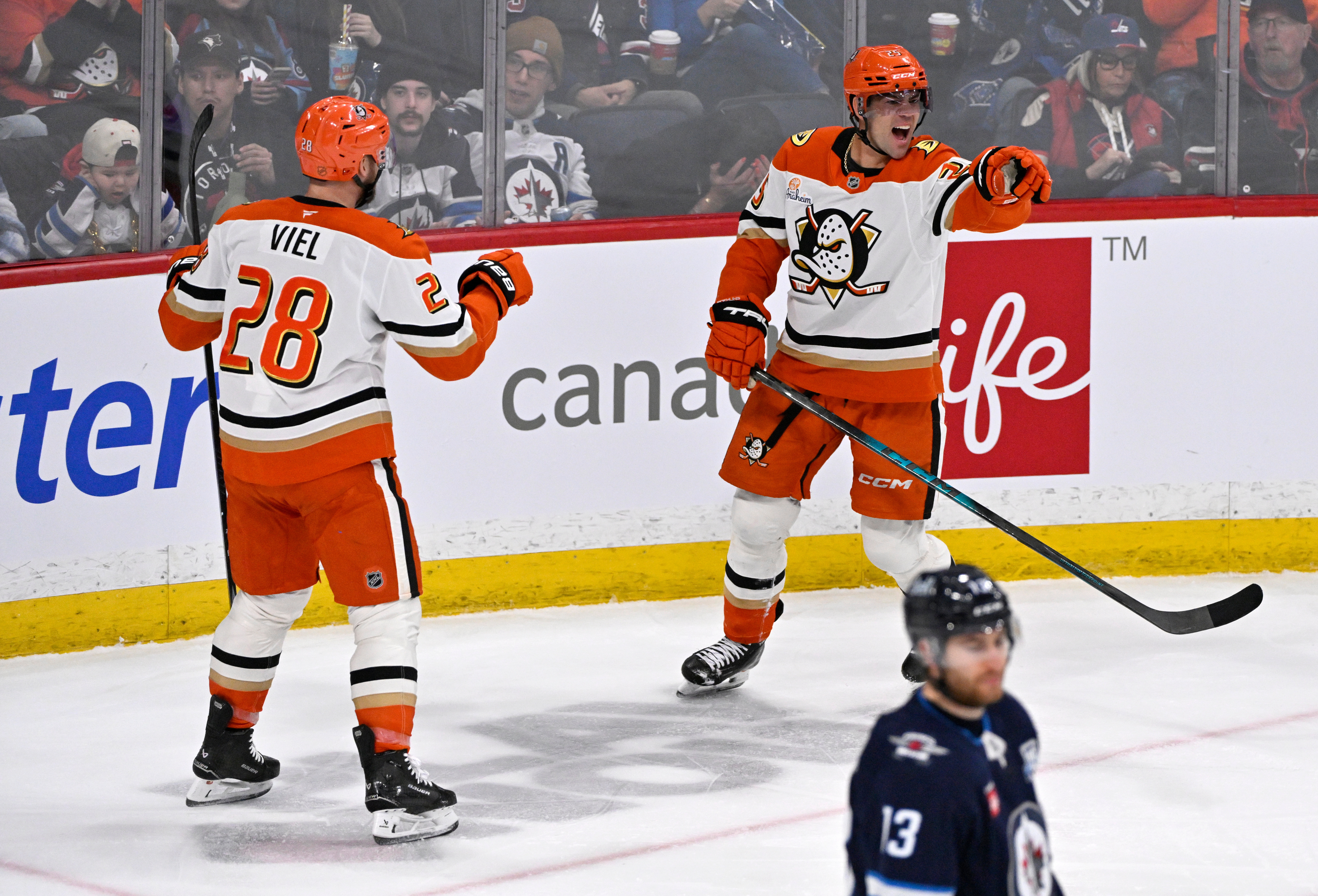 The Ducks’ Ryan Poehling, right, celebrates his go-ahead goal with...