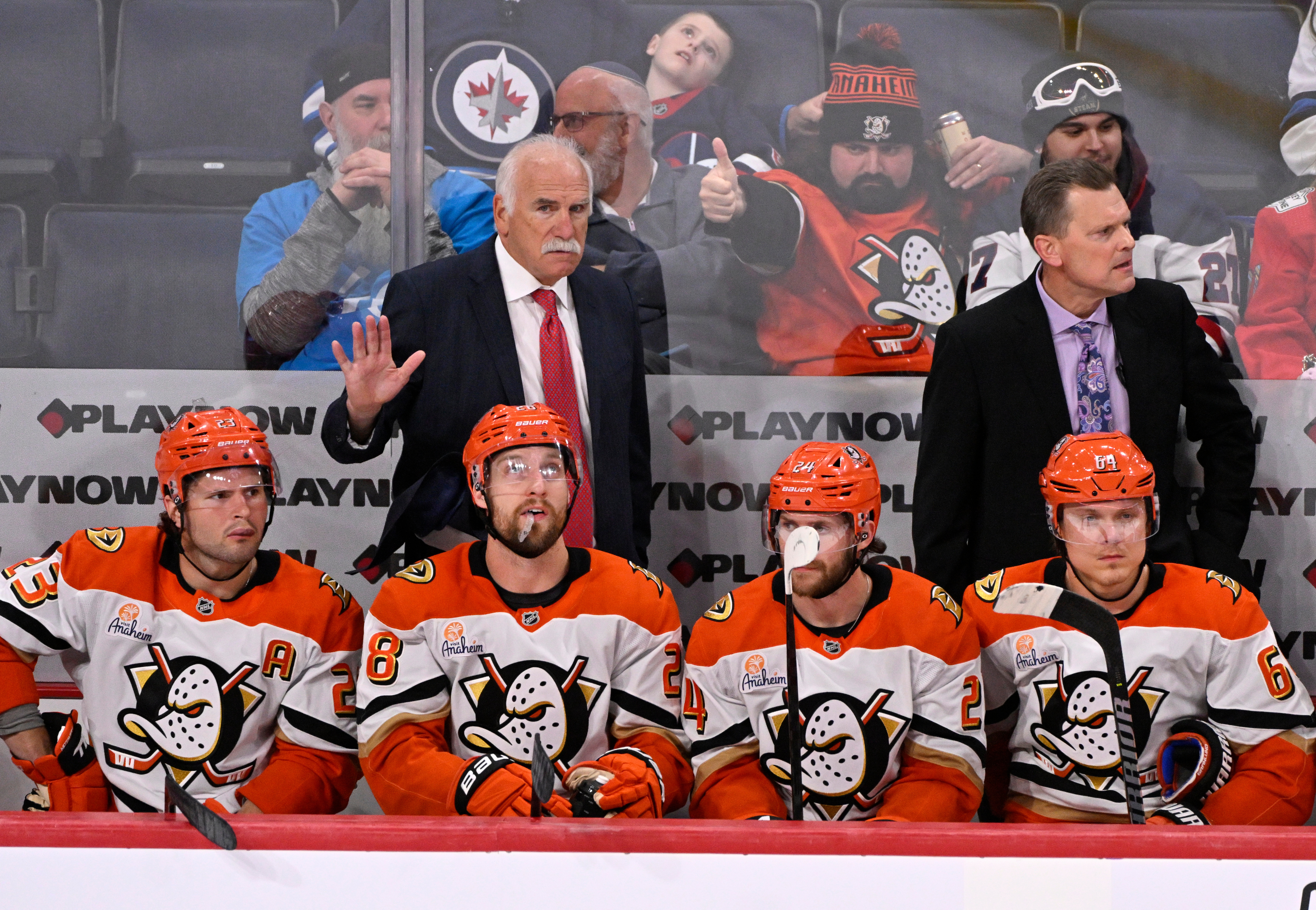 Ducks head coach Joel Quenneville instructs his players from the...