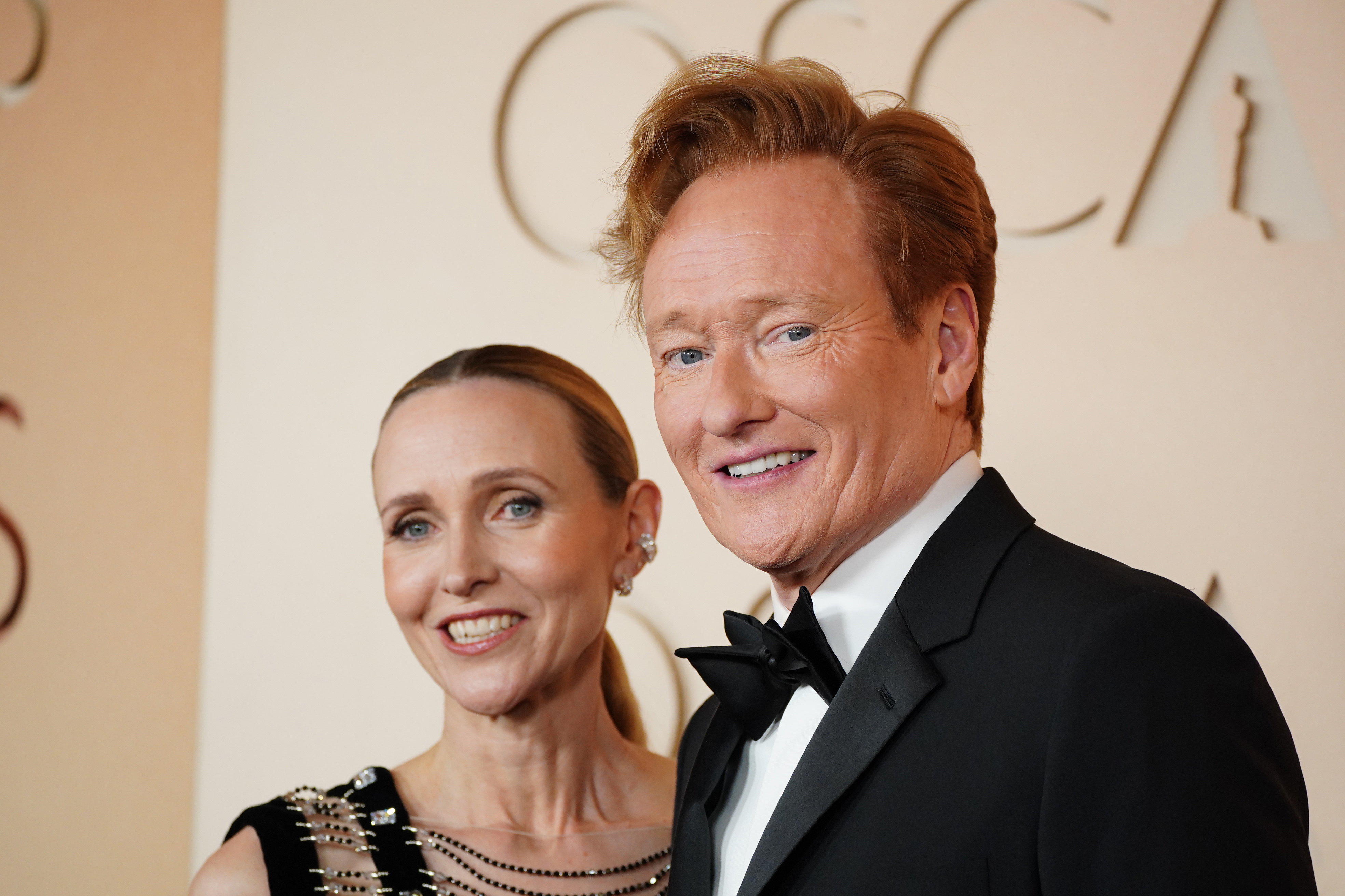 Liza Powel O’Brien, left, and Conan O’Brien arrive at the Oscars on Sunday, March 15, 2026, at the Dolby Theatre in Los Angeles. (Photo by Jordan Strauss/Invision/AP)
