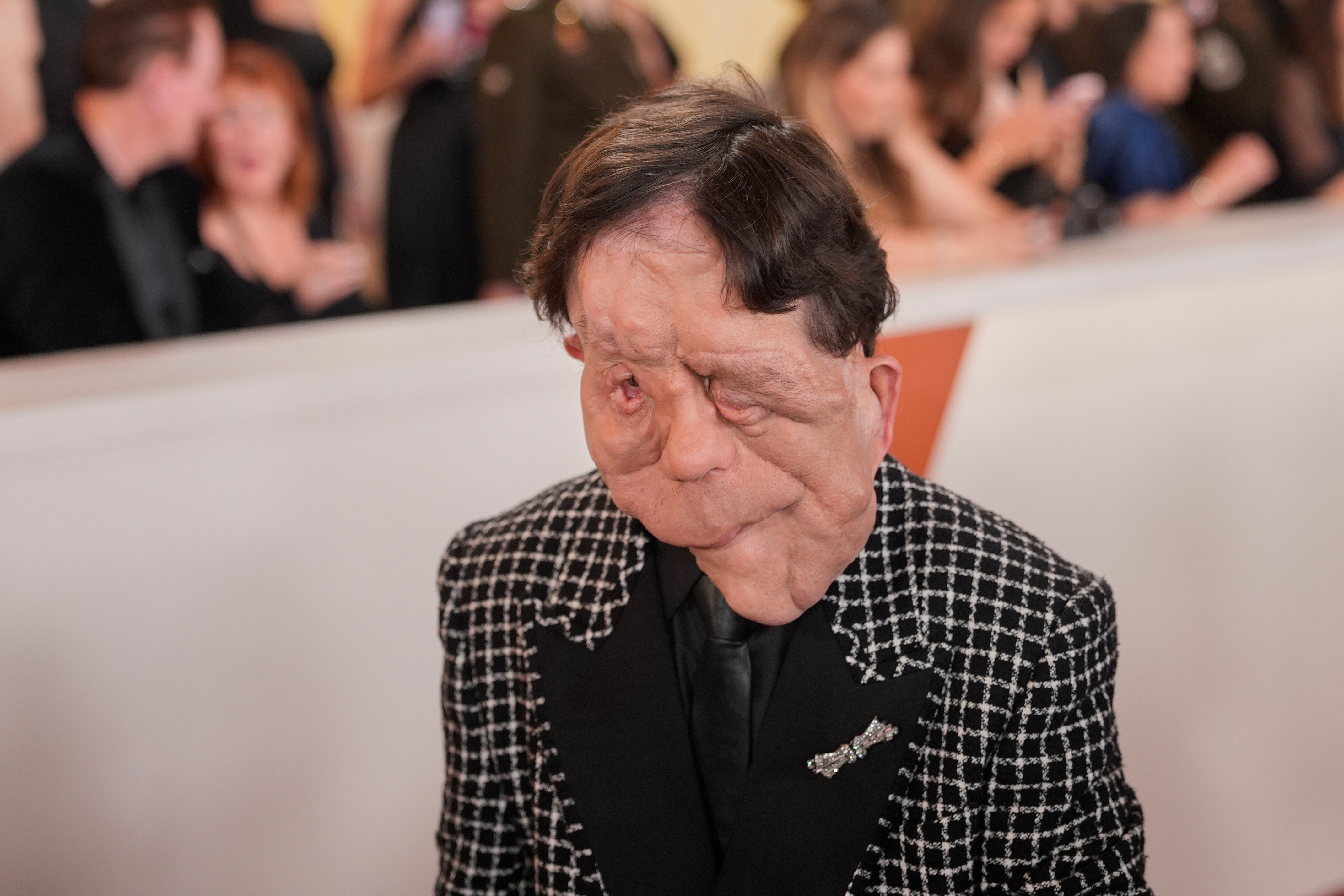 Adam Pearson arrives at the Oscars on Sunday, March 15, 2026, at the Dolby Theatre in Los Angeles. (AP Photo/John Locher)