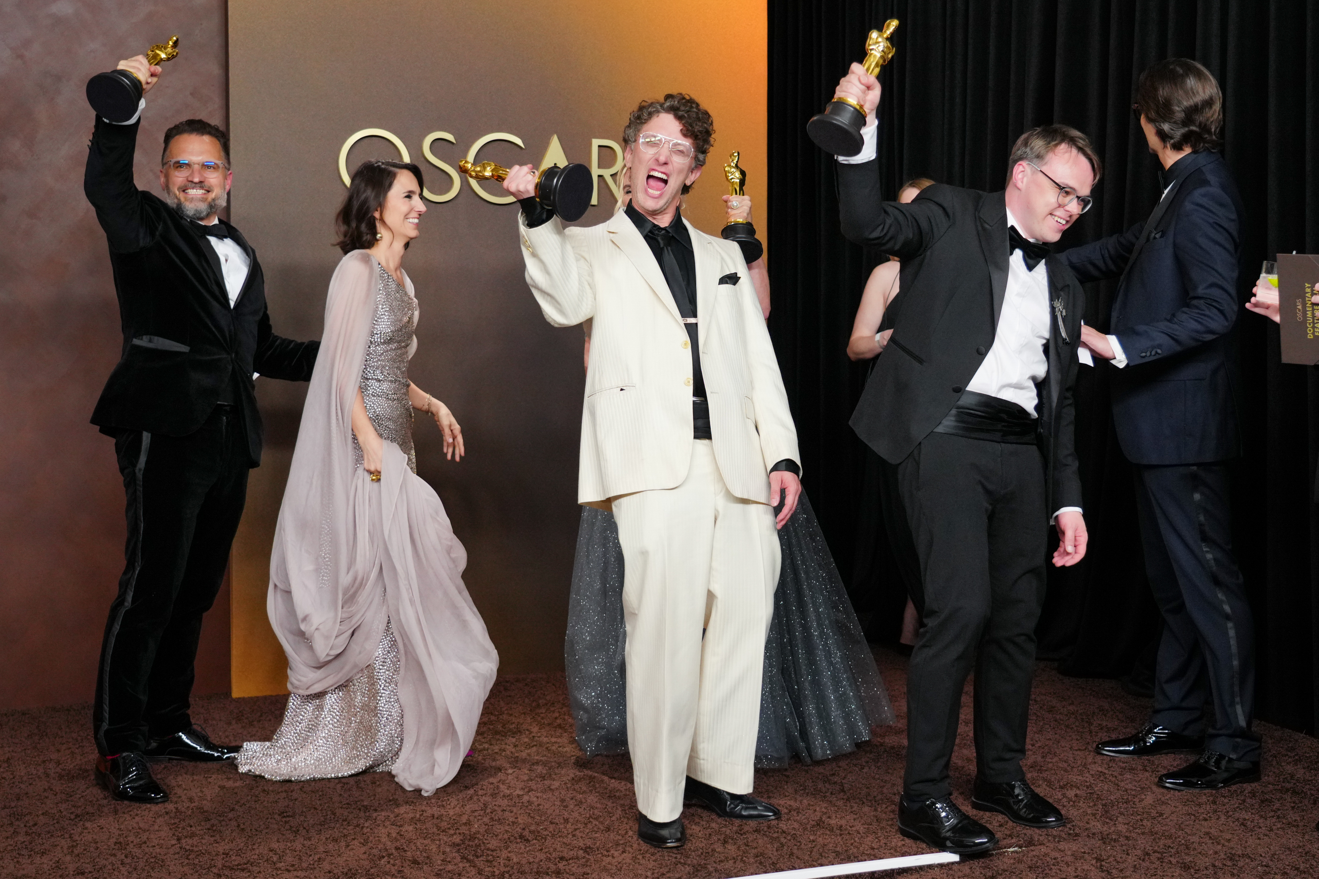 Radovan Sibrt, from left, Alzbeta Karaskova, David Borenstein, and Pavel Talankin, winners of the award for documentary feature film for “Mr. Nobody Against Putin,” pose in the press room at the Oscars on Sunday, March 15, 2026, at the Dolby Theatre in Los Angeles. (Photo by Jordan Strauss/Invision/AP)