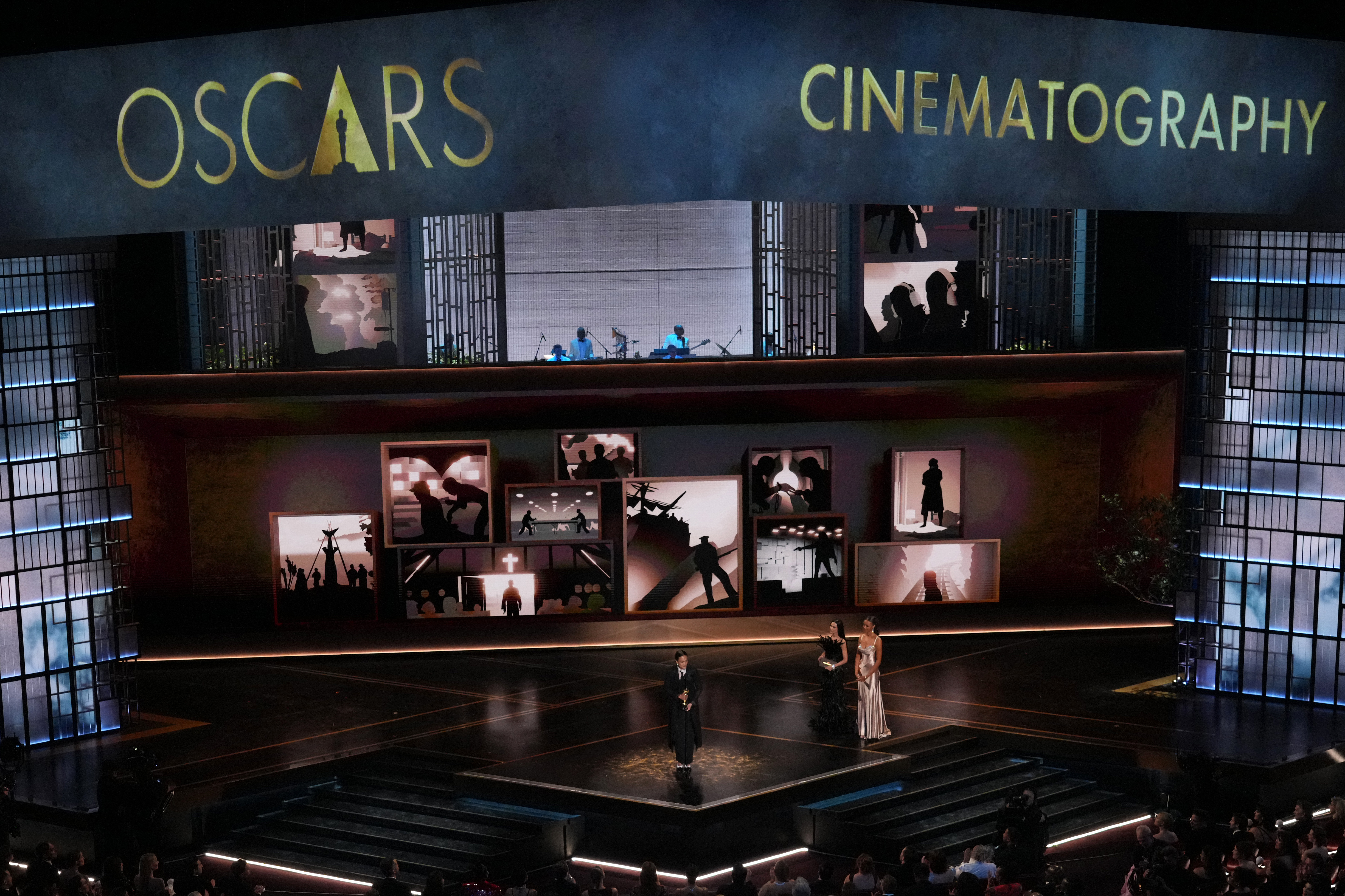 Autumn Durald Arkapaw accepts the award for cinematography for “Sinners” during the Oscars on Sunday, March 15, 2026, at the Dolby Theatre in Los Angeles. Demi Moore looks on from right. (AP Photo/Chris Pizzello)