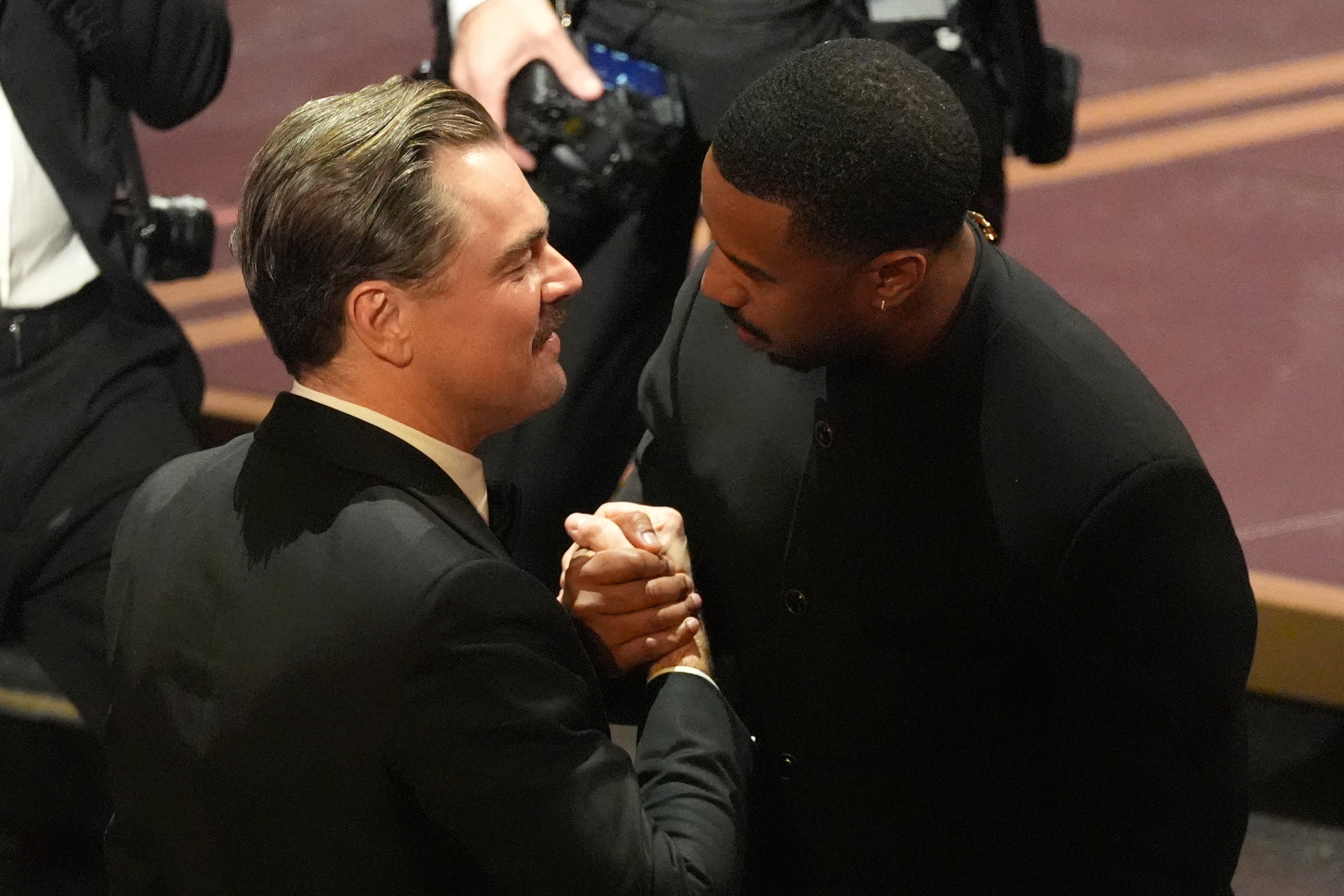 Leonardo DiCaprio, left, and Michael B. Jordan in the audience during the Oscars on Sunday, March 15, 2026, at the Dolby Theatre in Los Angeles. (AP Photo/Chris Pizzello)