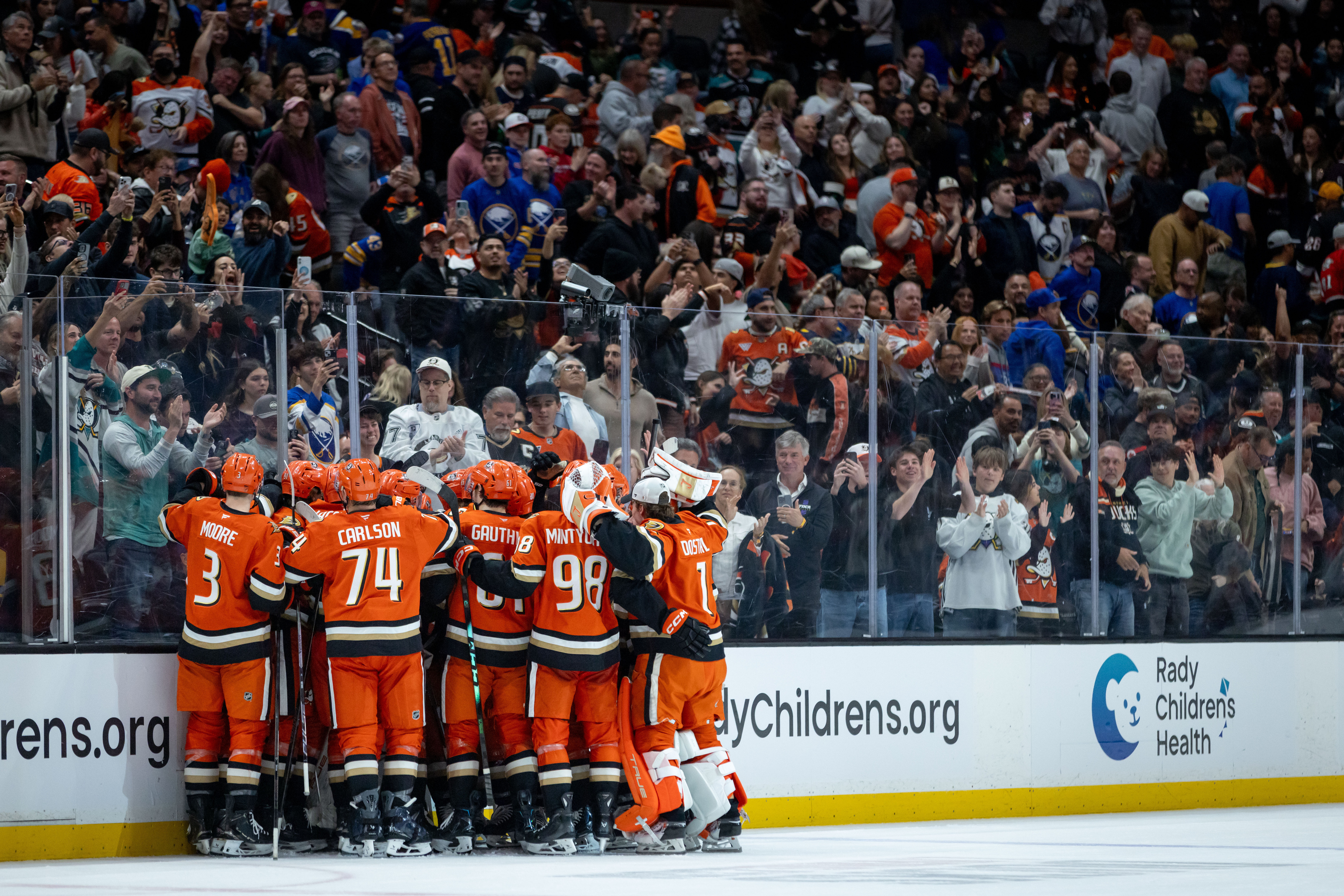 Ducks celebrate after defeating the Buffalo Sabres during the third...