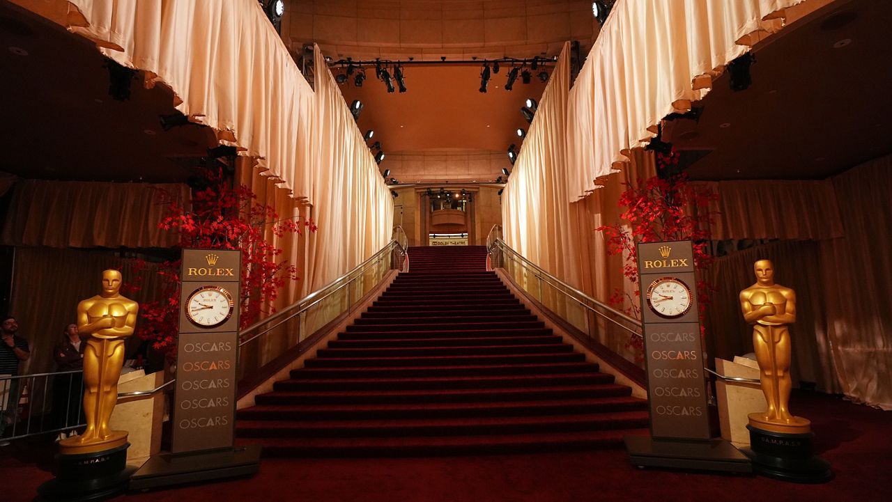 An empty red carpet is seen Saturday, March 14, 2026, at the Dolby Theatre in Los Angeles, the night before Sunday's 98th Academy Awards ceremony. (AP Photo/Gregory Bull)