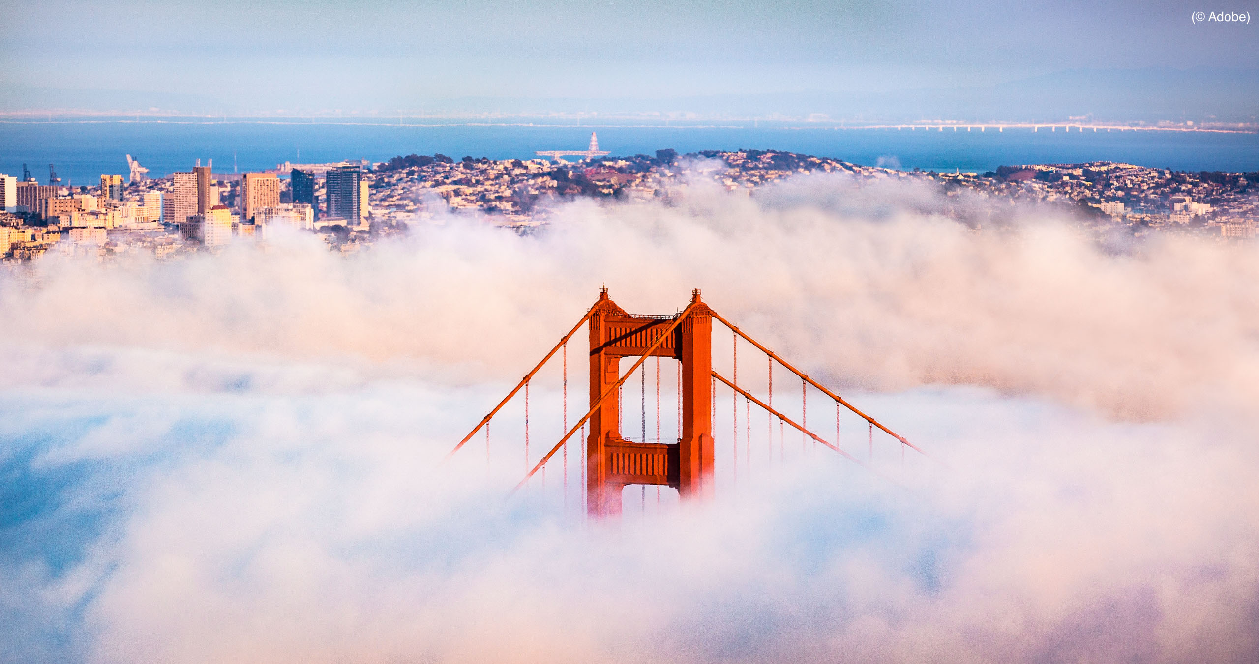 The Golden Gate Bridge in thick fog in San Francisco (© Adobe)