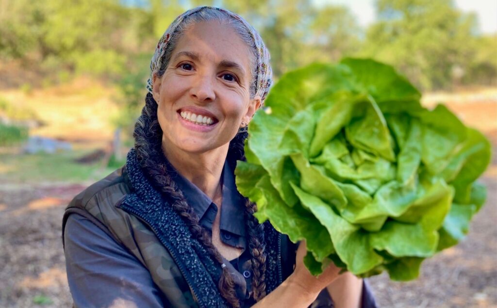 Woman holds lettuce