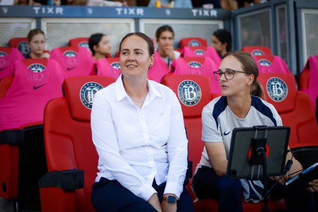 Bay FC's head coach Emma Coates, left, and Bay FC's assistant coach Gemma Davies, right, sit on the sidelines before a game against Angel City FC at PayPal Park in San Jose, Calif., on Saturday, March 21, 2026.  (Shae Hammond/Bay Area News Group)