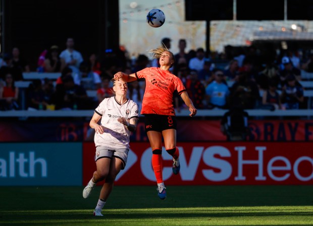 Bay FC's Claire Hutton (8) jumps for the ball against Angel City FC's Maiara Niehues (12) in the first half at PayPal Park in San Jose, Calif., on Saturday, March 21, 2026.  (Shae Hammond/Bay Area News Group)