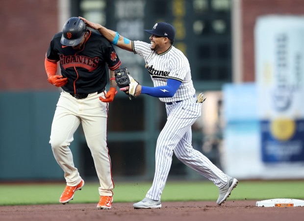 Sultanes de Monterrey second baseman Gustavo Nunez interacts with San Francisco Giants designated hitter Rafael Devers #16 after tagging him out in the first inning of their MLB game at Oracle Park in San Francisco, Calif., on Monday, March 23, 2026. (Jane Tyska/Bay Area News Group)