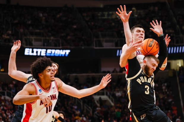 Purdue Boilermakers' Braden Smith (3) and Arizona Wildcats' Ivan Kharchenkov (8) fight for the ball in the first half during the NCAA Tournament West Regional final at the SAP Center in San Jose, Calif., on Saturday, March 28, 2026.  (Shae Hammond/Bay Area News Group)