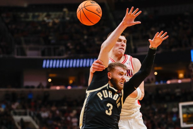 Purdue Boilermakers' Braden Smith (3) and Arizona Wildcats' Ivan Kharchenkov (8) fight for the ball in the first half during the NCAA Tournament West Regional final at the SAP Center in San Jose, Calif., on Saturday, March 28, 2026.  (Shae Hammond/Bay Area News Group)