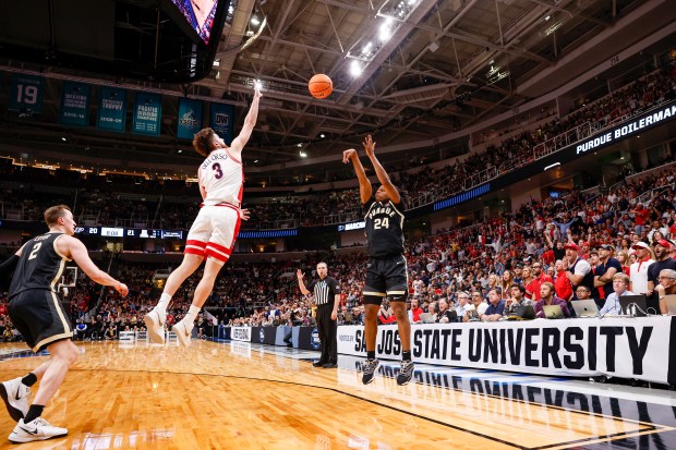 Purdue Boilermakers' Gicarri Harris (24) takes a shot against Arizona Wildcats' Anthony Dell'Orso (3) in the first half during the NCAA Tournament West Regional final at the SAP Center in San Jose, Calif., on Saturday, March 28, 2026.  (Shae Hammond/Bay Area News Group)