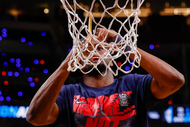 Arizona Wildcats' Dwayne Aristode (2) cuts the net after Arizona Wildcats wins against Purdue Boilermakers during the NCAA Tournament West Regional final at the SAP Center in San Jose, Calif., on Saturday, March 28, 2026.  (Shae Hammond/Bay Area News Group)