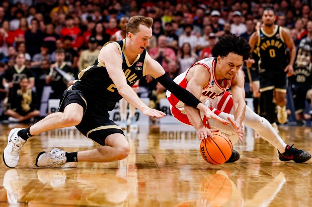 Arizona Wildcats' Brayden Burries (5) and Purdue Boilermakers' Fletcher Loyer (2) reach for the ball in the second half during the NCAA Tournament West Regional final at the SAP Center in San Jose, Calif., on Saturday, March 28, 2026.  (Shae Hammond/Bay Area News Group)