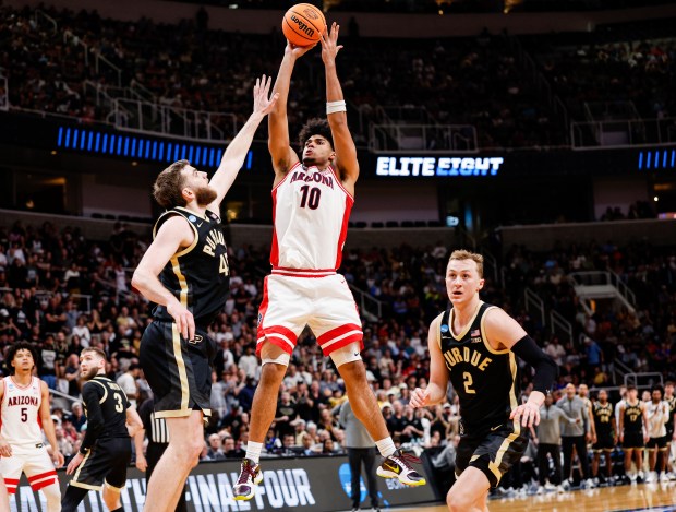 Arizona Wildcats' Koa Peat (10) takes a shot against Purdue Boilermakers' Oscar Cluff (45) in the second half during the NCAA Tournament West Regional final at the SAP Center in San Jose, Calif., on Saturday, March 28, 2026.  (Shae Hammond/Bay Area News Group)