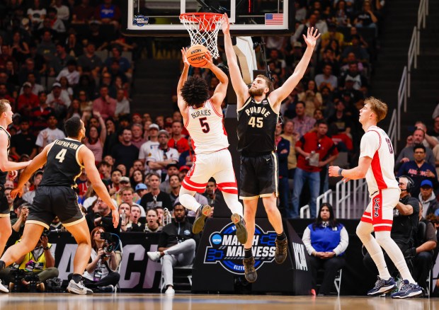 Arizona Wildcats' Brayden Burries (5) takes a shot against Purdue Boilermakers' Oscar Cluff (45) in the first half during the NCAA Tournament West Regional final at the SAP Center in San Jose, Calif., on Saturday, March 28, 2026.  (Shae Hammond/Bay Area News Group)