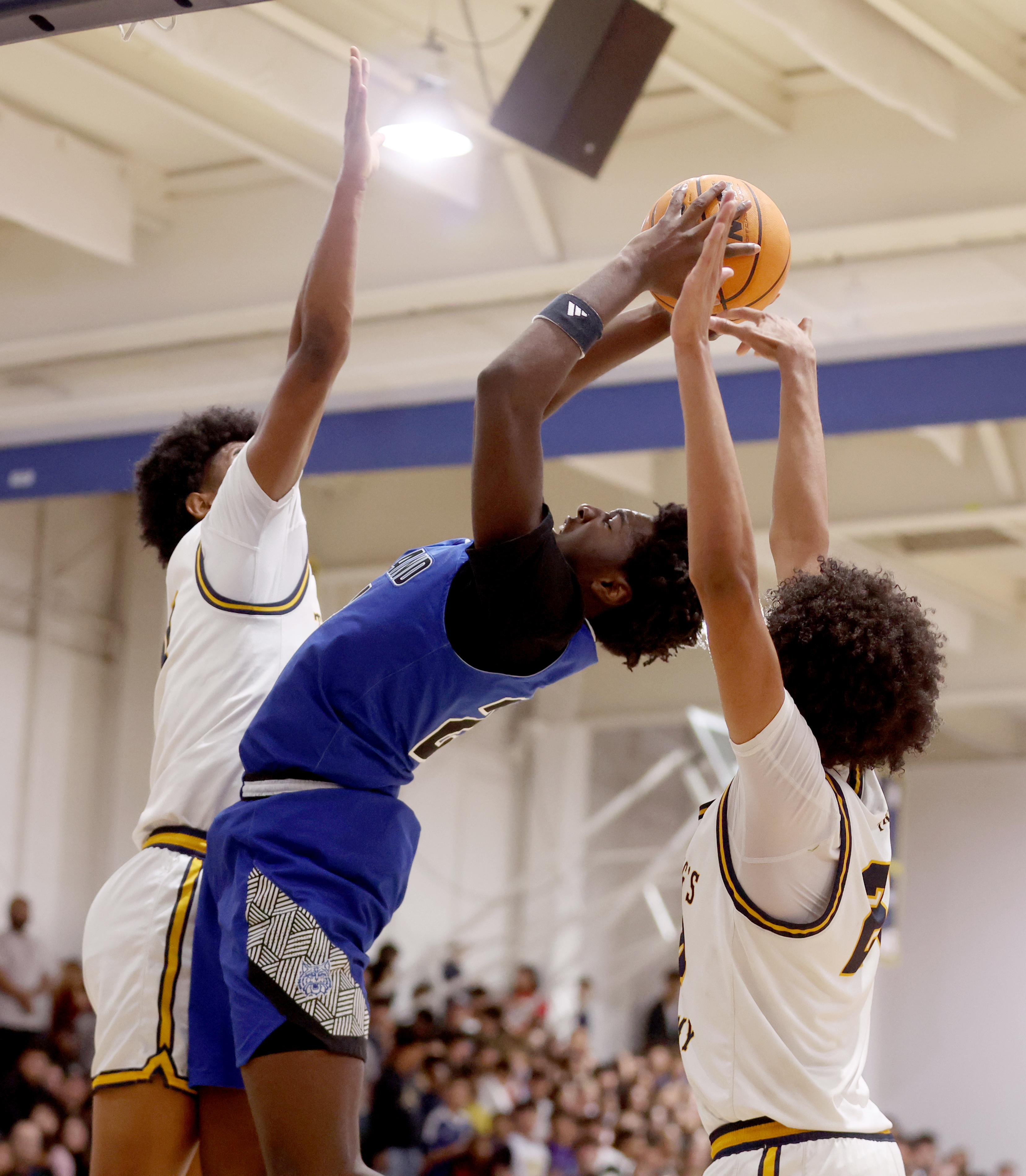 Oakland Highâs D'Ari Bruce (24) is double teamed by The...
