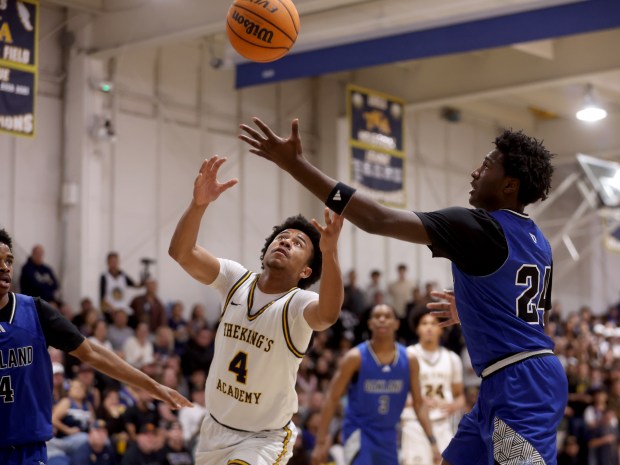 The King's Academy's Xavier Barnett (4) and Oakland High's (24) vie for a rebound in the first quarter of their NorCal Division 1 semifinal game at The King's Academy in Sunnyvale, Calif., on Saturday, March 7, 2026. (Jane Tyska/Bay Area News Group)