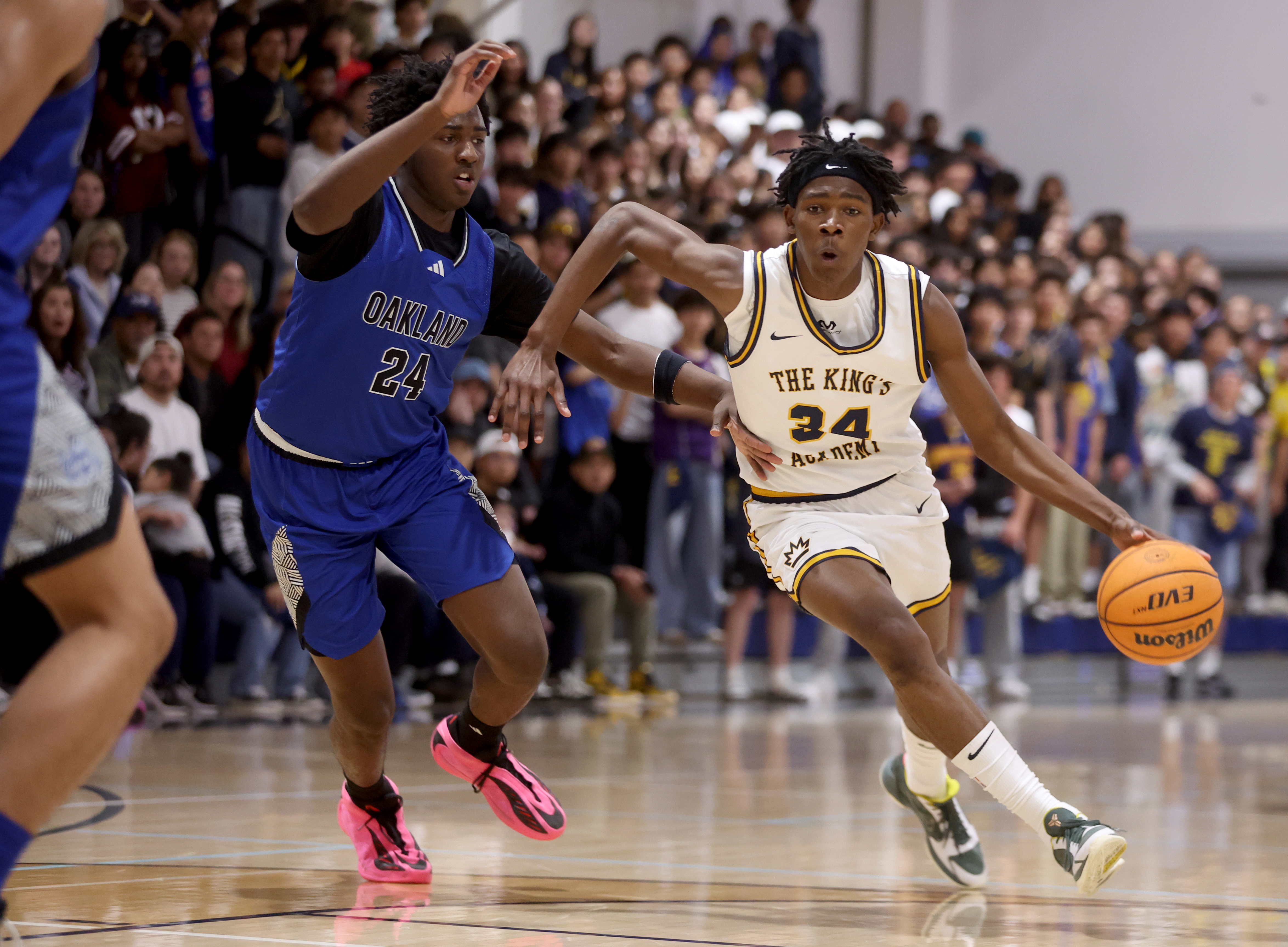 The Kingâs Academyâs Hezekiah Sires (34) brings the ball downcourt...