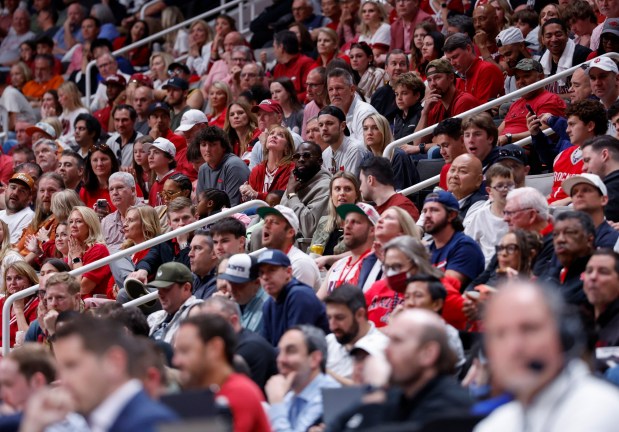 Golden State Warriors' Draymond Green, center, watches the Arkansas Razorbacks game against the Arizona Wildcats in the first half at the 2026 NCAA Division I West Regional Semifinal game at the SAP Center in San Jose, Calif., on Thursday, March 26, 2026. (Nhat V. Meyer/Bay Area News Group)