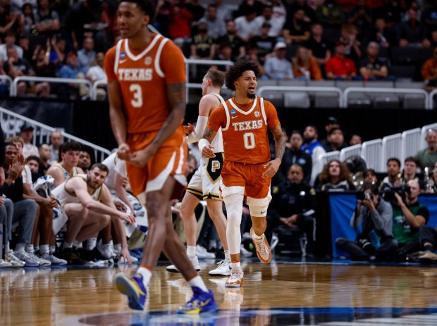 Texas Longhorns' Jordan Pope (0) celebrates his three-point basket against the Purdue Boilermakers in the first half at the 2026 NCAA Division I West Regional Semifinal game at the SAP Center in San Jose, Calif., on Thursday, March 26, 2026. (Nhat V. Meyer/Bay Area News Group)