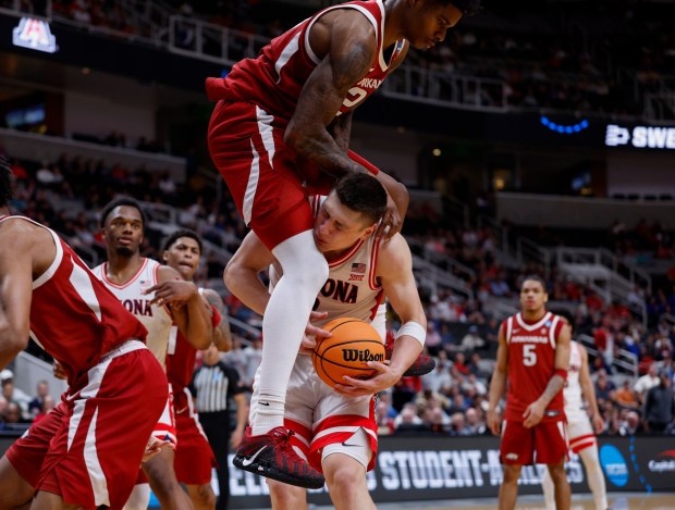 Arkansas Razorbacks' Nick Pringle (23) fouls Arizona Wildcats' Ivan Kharchenkov (8) in the second half at the 2026 NCAA Division I West Regional Semifinal game at the SAP Center in San Jose, Calif., on Thursday, March 26, 2026. (Nhat V. Meyer/Bay Area News Group)