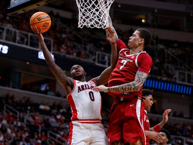 Arizona Wildcats' Jaden Bradley (0) takes a shot against Arkansas Razorbacks' Trevon Brazile (7) in the second half at the 2026 NCAA Division I West Regional Semifinal game at the SAP Center in San Jose, Calif., on Thursday, March 26, 2026. (Nhat V. Meyer/Bay Area News Group)