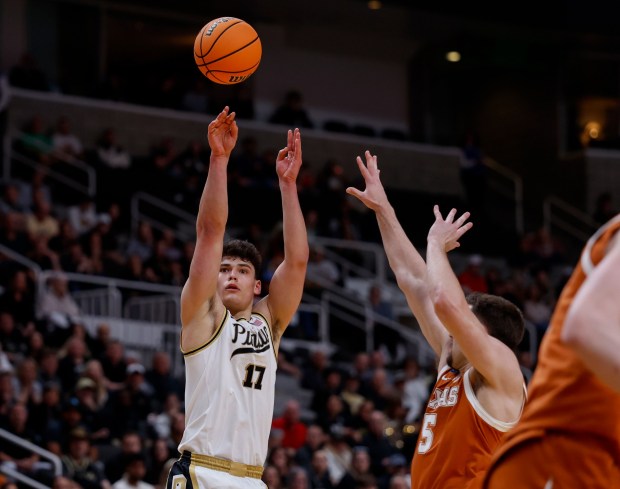 Purdue Boilermakers' Omer Mayer (17) takes a shot against Texas Longhorns' Camden Heide (5) in the first half at the 2026 NCAA Division I West Regional Semifinal game at the SAP Center in San Jose, Calif., on Thursday, March 26, 2026. (Nhat V. Meyer/Bay Area News Group)