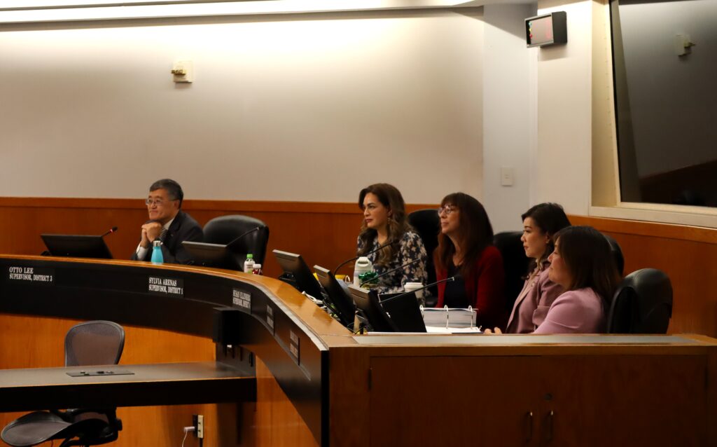 Santa Clara County Board Chambers with five supervisors seated, in order from left to right: Otto Lee, Sylvia Arenas, Susan Ellenberg, Betty Duong, Margaret Abe-Koga
