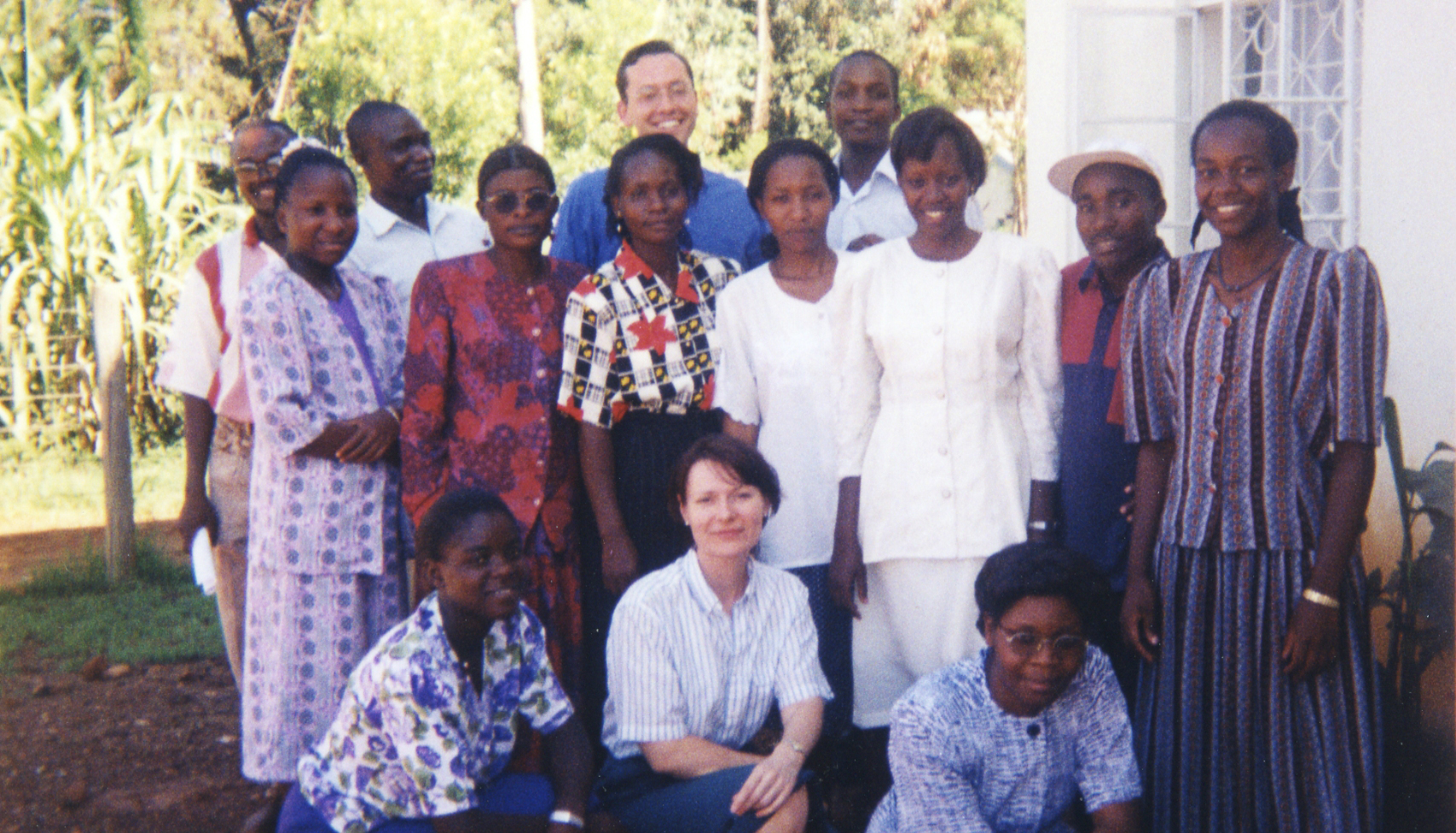 Ted Miguel poses in a group photo in 1998 with about a dozen NGO members working on the deworming project in Busia, Kenya