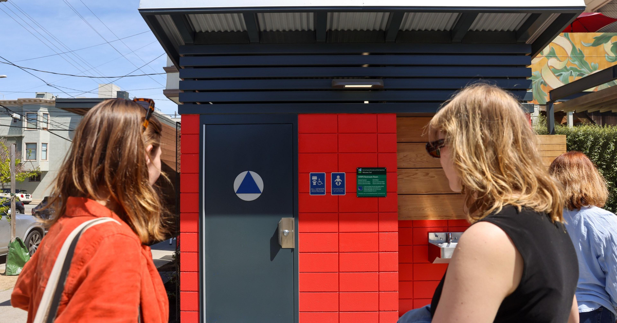 Adrienne Meyers, left, and Grace Shaver check out the new public restroom in the Noe Valley Town Square in San Francisco on Tuesday.
