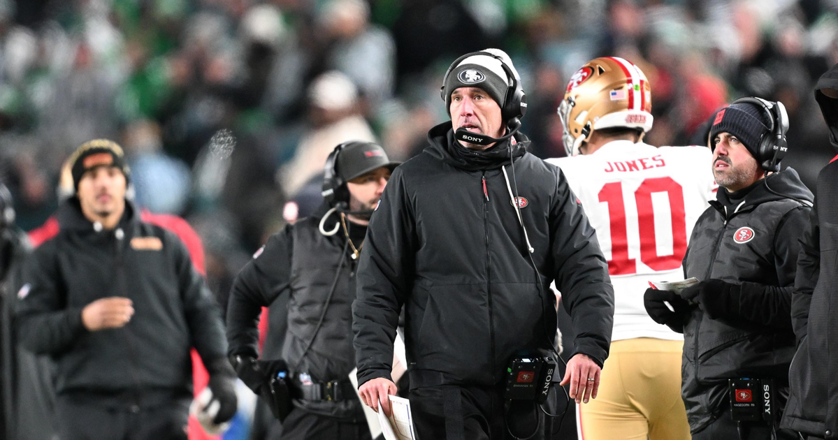 David Lombardi smiles in front of a red background with the Golden Gate Bridge; text reads “DAVID LOMBARDI 49ERS REPORTING @LombardiHimself.”