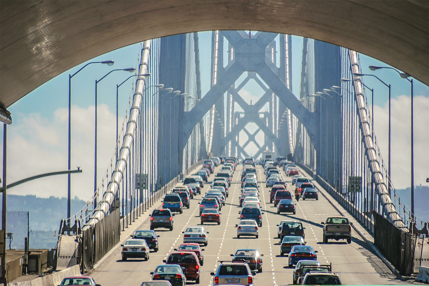 Cars stuck in gridlock traffic on a bridge.