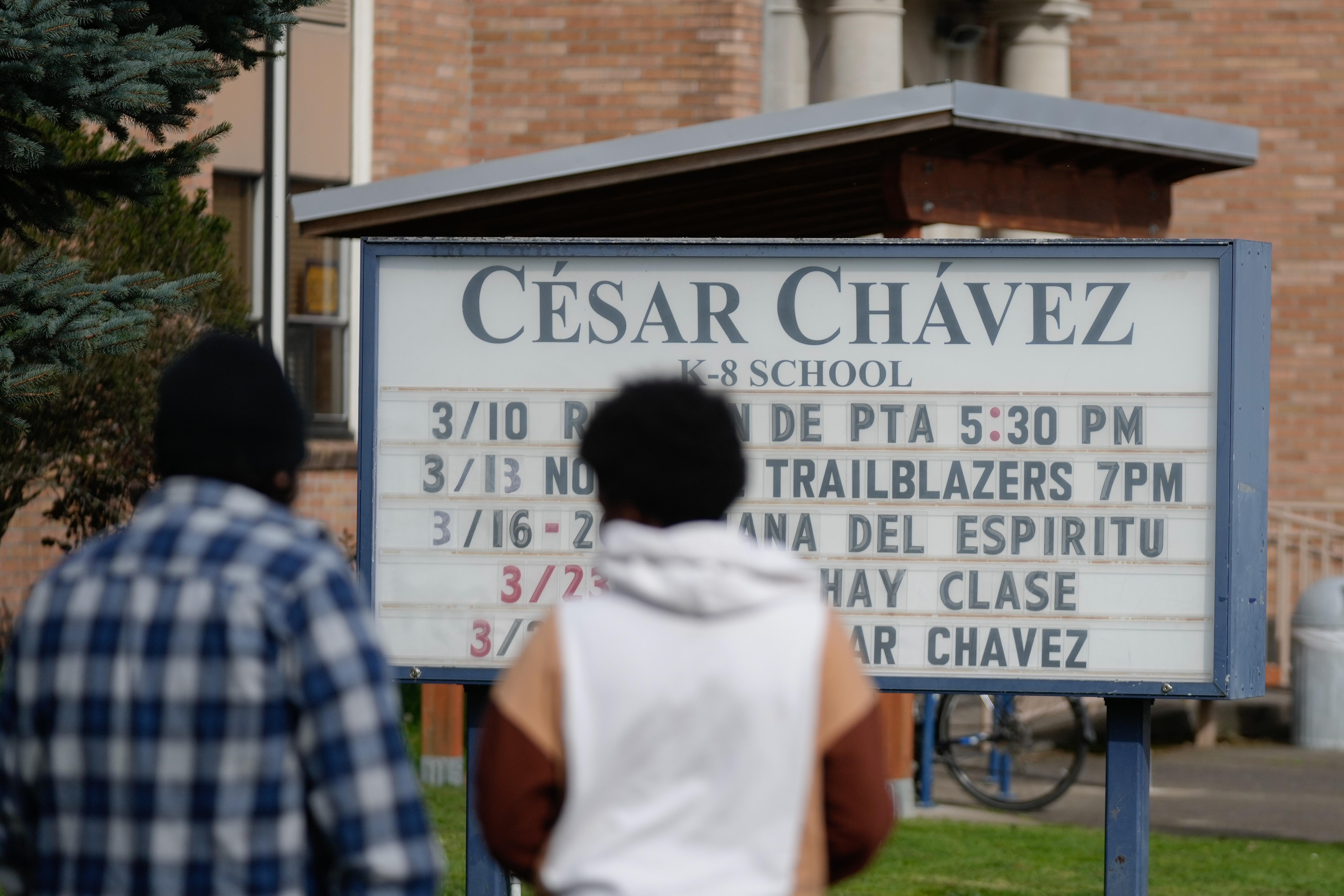 A sign for Cesar Chavez School is seen on Wednesday,...