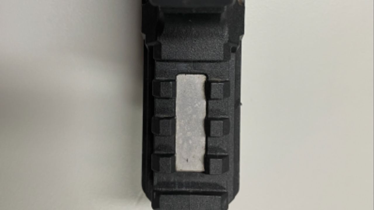 Close-up of recovered ghost gun, showing missing serial number. (Department of Justice)