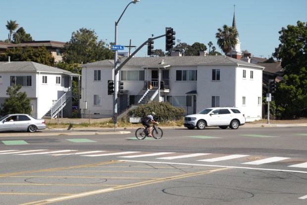 A cyclist crosses Nimitz Boulevard at Atascadero Drive in Point Loma. (Tyler Faurot)
