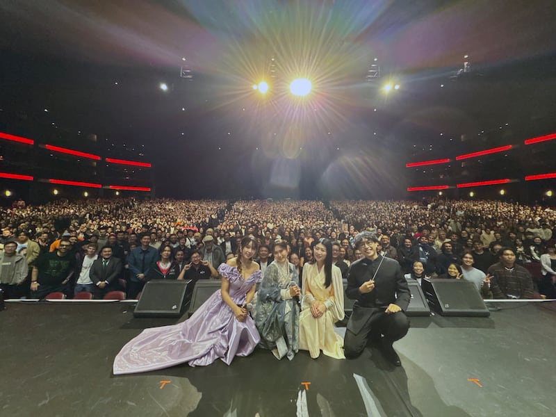 Performers taking a photo in front of an audience