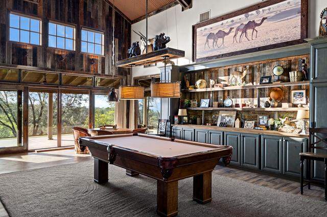 The property has plenty of spaces to hang out, including the lodge’s game-and-gathering area, with a pool table set at the north end of the 1,600-square-foot great room, and a separate cigar bar.