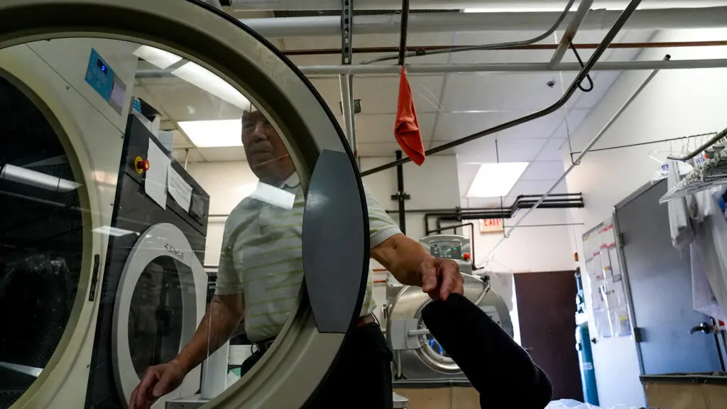 Ha Wan Ku, Vogue Cleaners owner, working on March 18, 2026. Photo by Denis Akbari.