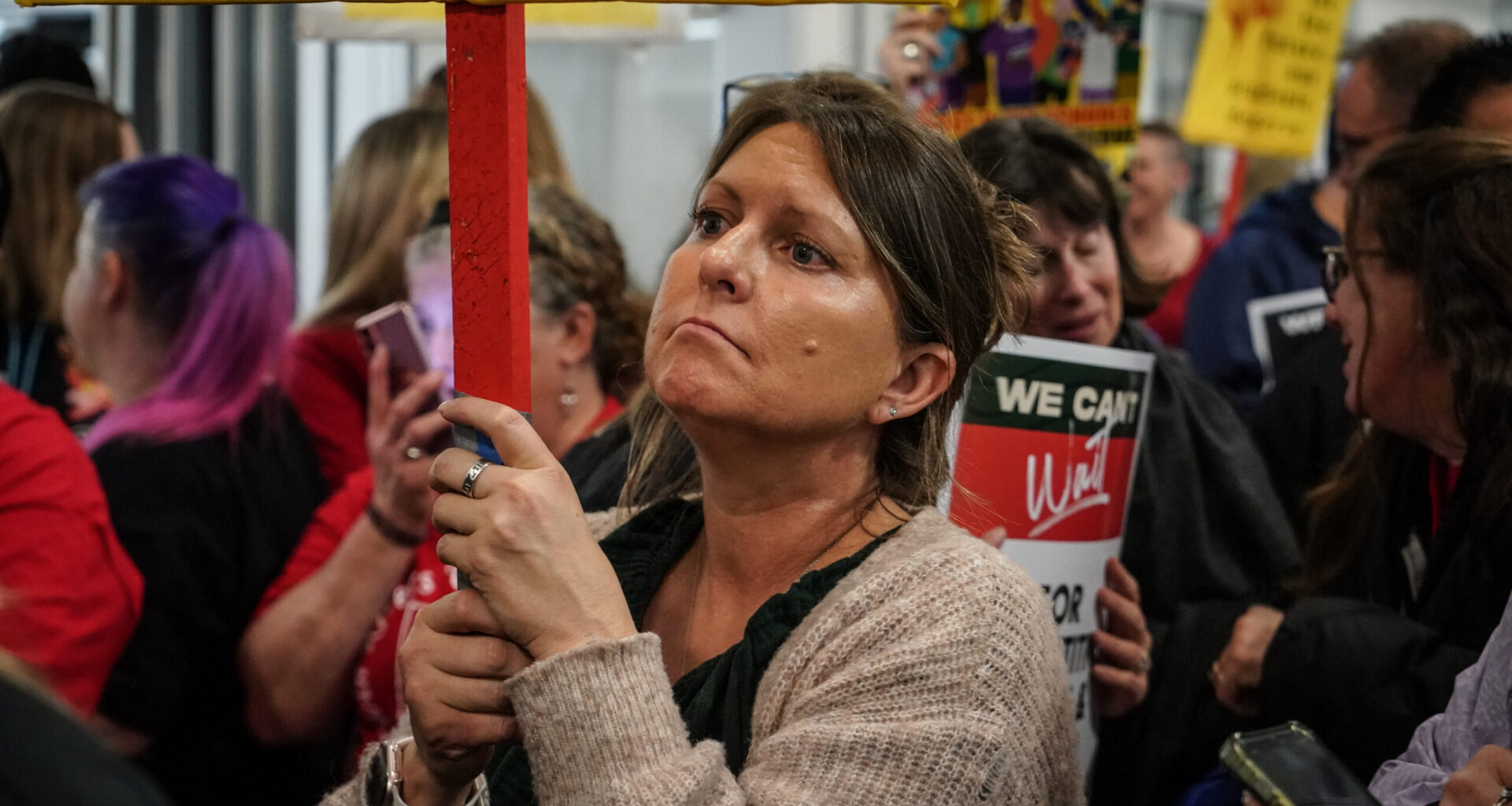 Woman holding picket sign